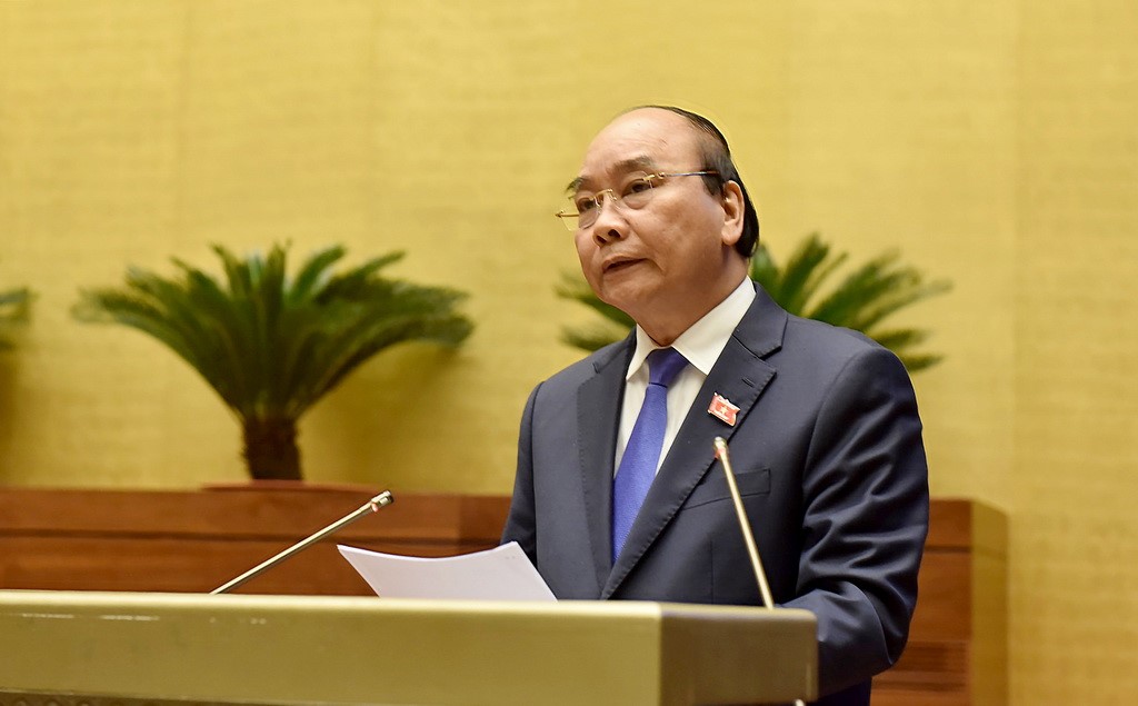 Thủ tướng Chính phủ Nguyễn Xuân Phúc làm rõ thêm một số vấn đề liên quan thuộc trách nhiệm của Chính phủ và trực tiếp trả lời chất vấn của đại biểu Quốc hội. Ảnh: VGP/Nhật Bắc