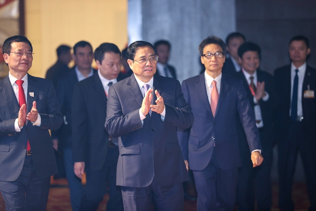 Thủ tướng Phạm Minh Chính, Phó Thủ tướng Vũ Đức Đam cùng các đại biểu dự chương trình - Ảnh: VGP/Nhật Bắc
